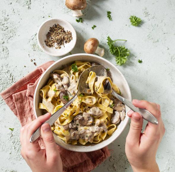 Bandnudeln mit Champignon-Sahnesoße